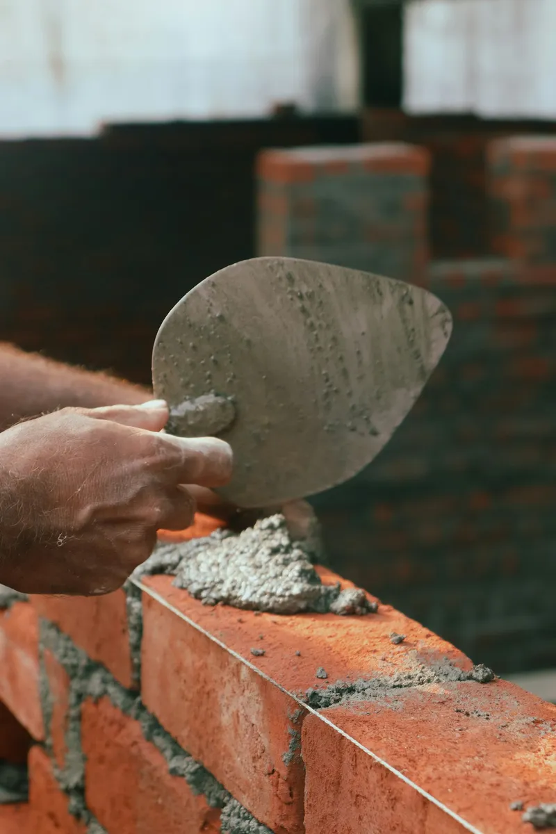 Bricklayer laying bricks during a refurbishment