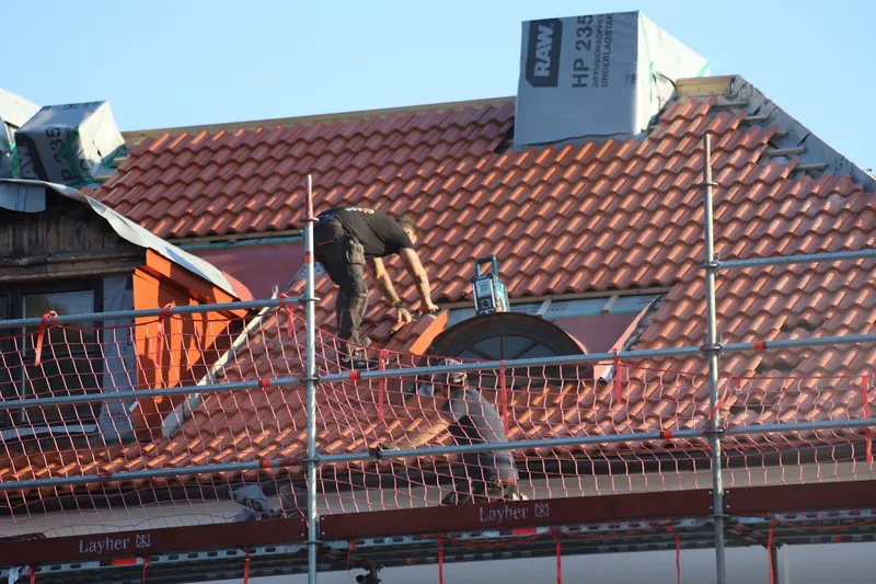 Roofer working on a pitched roof