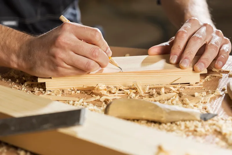Joiner cutting timber